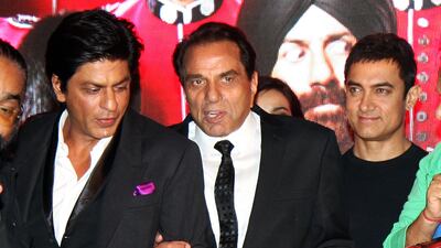 Shahrukh Khan, Dharmendra (centre) and Aamir Khan during a launch ceremony for the Hindi film Yamla Pagla Deewana 2. AFP