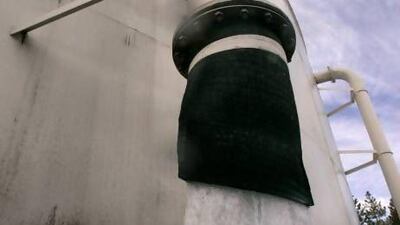 More than 42 hundred gallons a minute of water flows out of one of two storage tanks used by the town of McCloud, Calif., to supply drinking Wednesday, Feb. 26, 2008. Nestle Waters North America, Inc., has proposed building a water bottling plant in the town to bottle some of the surplus water.(AP Photo/Rich Pedroncelli)