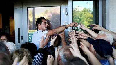 Greek banks struggled to arrange payments to hundreds of thousands of cash-strapped pensioners after earlier being closed by the government. Angelos Tzortzinis / AFP
