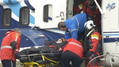 A survivor is lifted out of a helicopter at the Health Sciences Center in St John's, New Foundland, Canada, on March 12, 2009.