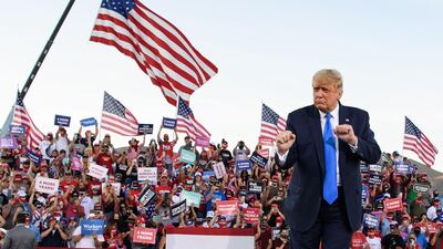 US President Donald Trump dances at the end of a rally at Carson City Airport in Nevada on October 18. AFP