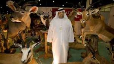 Abdullah al Ali, the general manager of Al Maha Taxidermy, at his showroom during the Abu Dhabi Hunting and Equestrian Exhibition.