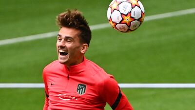 Atletico Madrid's Spanish midfielder Antoine Griezmann heads the ball during a training session at the Wanda Metropolitano stadium in Madrid on September 14, 2021 on the eve of their UEFA Champions Leage first round group B football match against Porto. (Photo by GABRIEL BOUYS / AFP)