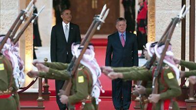 Jordan's King Abdullah II reviews an honour guard with the US president Barack Obama during a welcoming ceremony at Al Hummar Palace in Amman on Friday. Jordan was the last stop on Mr Obama's Middle East tour. Saul Loeb / AFP
