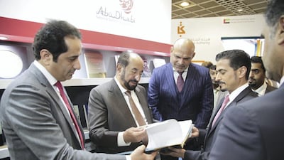 Sharjah Ruler Sheikh Sultan bin Mohammed Al Qasimi, second left, visits the Abu Dhabi tourist pavilion at the Frankfurt International Book Fair. Abu Dhabi Culture and Tourism