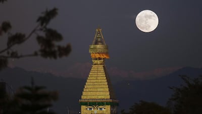 The moon rises over an upper portion of the Boudha stupa in Kathmandu, Nepal. Narendra Shrestha / EPA