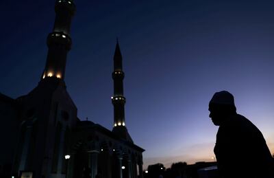 A Muslim leaves to perform maghrib prayer after breaking his fast during Ramadan, outside Al Farooq Mosque in Dubai. EPA