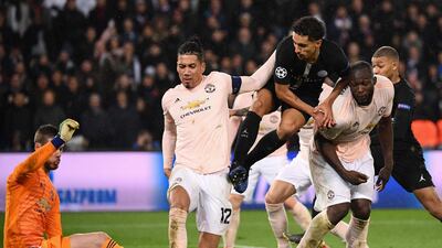Manchester United goalkeeper David de Gea saves from PSG defender Marquinhos. AFP