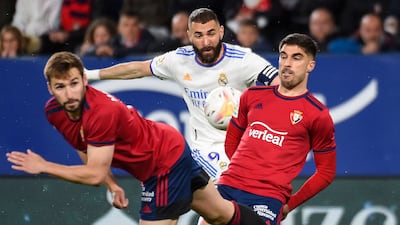 Karim Benzema is crowded out by Osasuna midfielder Jon Moncayola and defender Nacho Vidal. AFP