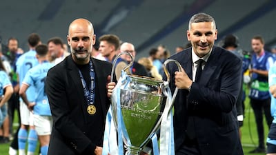 Manchester City manager Pep Guardiola, left and chairman Khaldoon Al Mubarak celebrate with the trophy after City's 1-0 victory over Inter Milan in the Champions League final at the Ataturk Olympic Stadium, Istanbul. PA