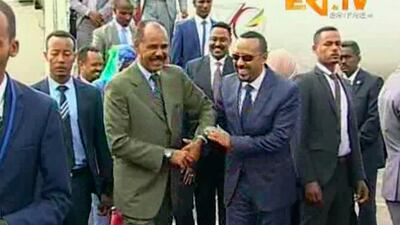 Eritrea's President Isaias Afwerki, centre left, welcomes Ethiopian Prime Minister Abiy Ahmed in Asmara on July 8, 2018. ERITV via AP