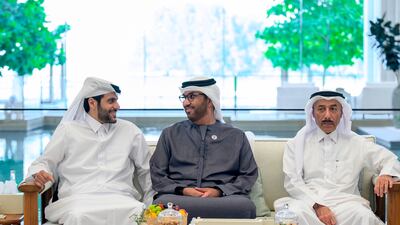 Dr Sultan Al Jaber, Minister of Industry and Advanced Technology and managing director and group chief executive of Adnoc, speaks with a Qatari dignitary