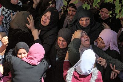 Women react during the funeral of Palestinian Chas Kamamji in Jenin in the occupied West Bank, on April 14. AFP