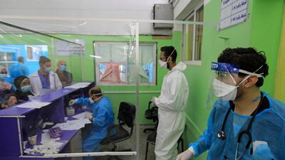 Palestinian medics work at al-Shifa Hospital amid a spike in coronavirus cases, in Gaza City on April 7, 2021. / AFP / MAHMUD HAMS