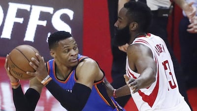 Oklahoma City Thunder guard Russell Westbrook, left, goes up against Houston Rockets guard James Harden during the first half of Game 2 of the NBA Western Conference Playoffs first-round game. Larry W Smith / EPA