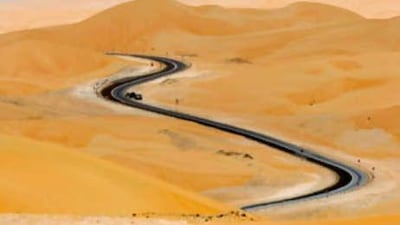 Empty promise: a road snakes through the - less and less - Empty Quarter, which is gradually being transformed from desert to destination.