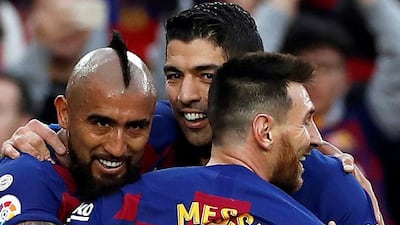 Vidal celebrates with teammates Luis Suarez and Lionel Messi. EPA