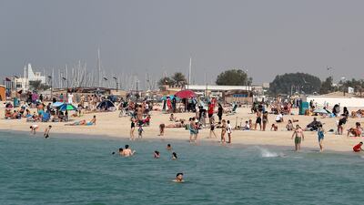 People take to the sea at Kite Beach. Pawan Singh / The National