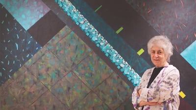 Samia Halaby stands next to her painting, Night Seeing.