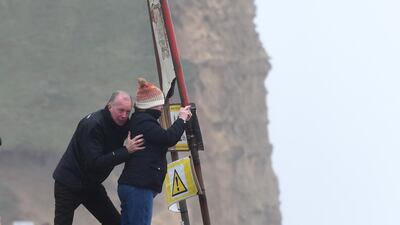 People take a photograph as Storm Ciara arrives in West Bay, United Kingdom. Getty Images