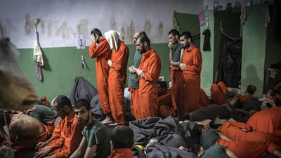Men suspected of being affiliated with ISIS pray in a cell of Sinaa prison in the Syrian city of Hassakeh. AFP