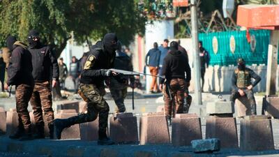 Security forces try to disperse anti-government protesters during clashes in downtown Baghdad, Iraq, Monday, Jan. 27, 2020. (AP Photo/Hadi Mizban)