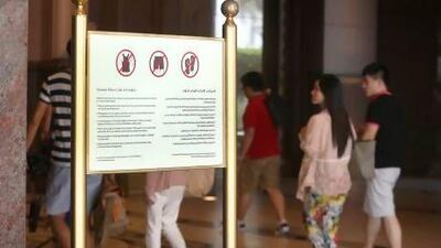 Signs at Abu Dhabi's luxurious Emirates Palace hotel advise westerners to dress more conservatively during Ramadan in public places such as malls, hotels and restaurants. Fatima Al Marzooqi / The National