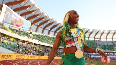 Shelly-Ann Fraser-Pryce celebrates after winning gold in the women's 100m. AFP