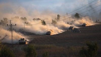 Israeli tanks manoeuvre outside the northern Gaza Strip. Ronen Zvulun / Reuters