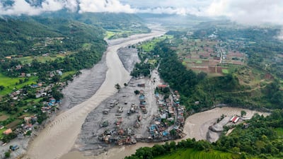 Houses lying deluged in sludge after flash floods at Devighat, Bidur Municipality, along the confluence of the Trishuli and Tadi rivers in Nepal's Nuwakot district. AFP