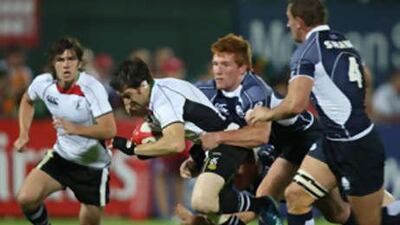 Jonny MacDonald, left, some of his mates in the Arabian Gulf side look set to make big strides in the world of rugby after their performance during the Dubai Sevens last week.