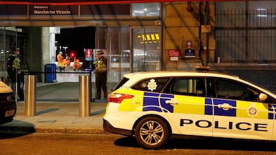 Police stand at the end of a tram platform following a stabbing at Victoria station in Manchester. Reuters