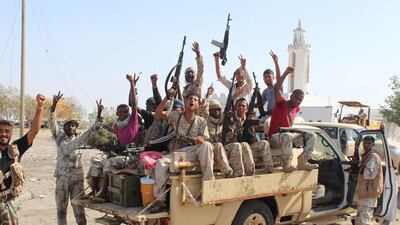 Pro-government forces flash victory signs as they join an operation to drive Al Qaeda fighters out of the capital of the southern Yemeni province of Abyan on April 23, 2016. Saleh Al Obeidi / AFP