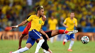Neymar of Brazil is challenged by Francisco Javier Rodriguez of Mexico during their match on Tuesday at the 2014 World Cup. Buda Mendes / Getty Images