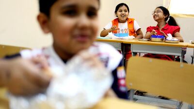 September 21, 2010 / Abu Dhabi / (Rich-Joseph Facun / The National) Students at the Private International English School eat their lunches Tuesday, September 21, 2010 in Mussafah. The school requires that each student only bring vegetarian friendly food to school.