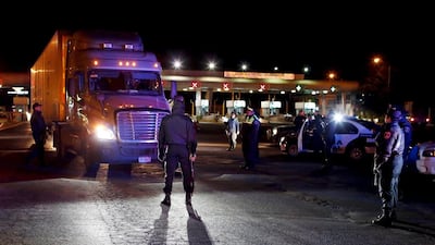 Policemen inspecting a trailer at a checkpoint outside the Altiplano federal penitentiary. Tomas Bravo/Reuters