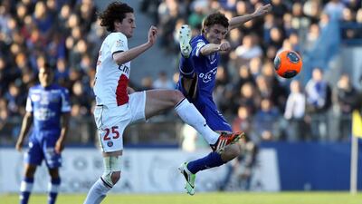 Paris Saint-Germain’s French midfielder Adrien Rabiot, left, vies with Bastia’s French midfielder Yannick Cahuzac during the French L1 football match between Bastia (SCB) and Paris Saint-Germain (PSG) at the Armand Cesari Stadium in Bastia, Corsica, on March 8, 2014. Pascal Pochard-Casabiance / AFP