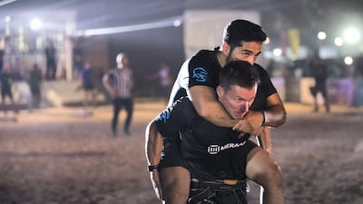 Male employees compete on the final day of the Dubai Government Games held at Kite Beach, Dubai. Reem Mohammed / The National