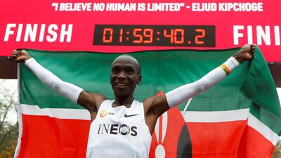 Kenya's Eliud Kipchoge celebrates after crossing the finish line during his attempt to run a marathon in under two hours in Vienna, Austria on October 12, 2019. Reuters