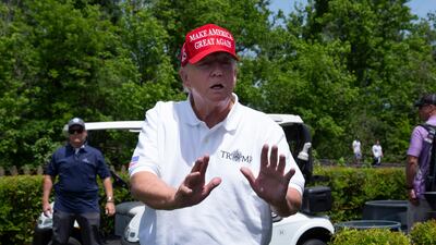 Mr Trump briefly speaks to members of the media. EPA