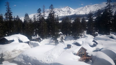 A thick blanket of snow covers houses in Mammoth Lakes. EPA