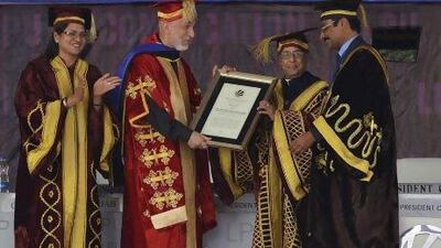 Afghanistan's president Hamid Karzai (second from left) receives an honourary degree from his Indian counterpart Pranab Mukherjee at the Lovely Professional University on the outskirts of the northern Indian city of Jalandhar.