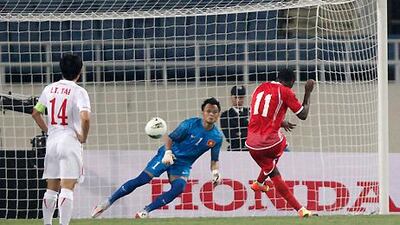 Ahmed Khalil fires home the UAE's penalty to open the scoring against Vietnam in their Asian Cup qualifying match.