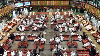 Traders follow market movements at the Kuwait bourse. Yasser Al Zayyat / AFP