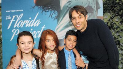 Cast members Prince, Valeria Cott, and Christopher Rivera with director Sean Baker. Getty
