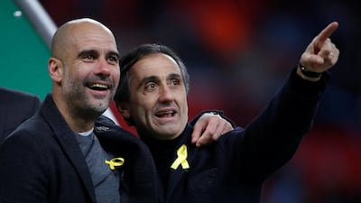 Manchester City manager Pep Guardiola celebrates after winning the League Cup at Wembley. Guardiola wore a yellow ribbon in support of jailed Catalan independence leaders. Carl Recine / Reuters