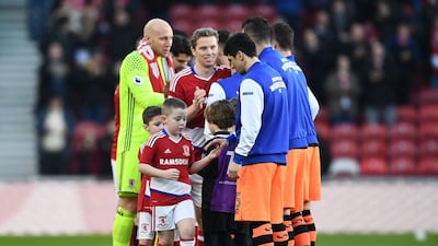 Middlesbrough and Chelsea teams shake hands prior to kick-off. Laurence Griffiths / Getty Images