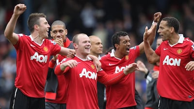 Michael Carrick, Chris Smalling, Wayne Rooney, Nani and Rio Ferdinand of Manchester United celebrate clinching the 2011 Premier League title. Getty Images