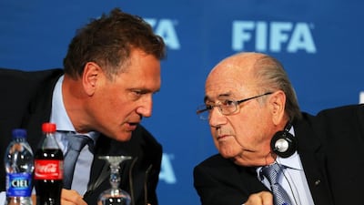 Fifa president Sepp Blatter, right, talks with Fifa secretary general Jerome Valcke during a news conference in 2014. EPA/MOHAMED MESSARA