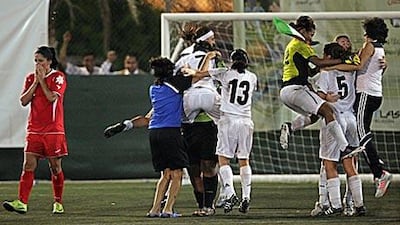The UAE women's seven-a-side football team celebrate after winning the Armed Forces Officers Club 13th Open Sports Festival tournament.